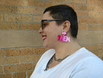 Alister wearing Ombre They/Them Pronoun Earrings